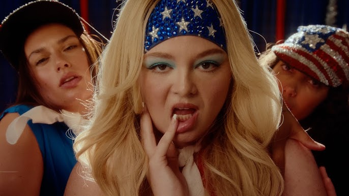 meg-stalter’s-‘prettiest-girl-in-america’-video-is-the-exact,-campy-joyride-we-need-right-now