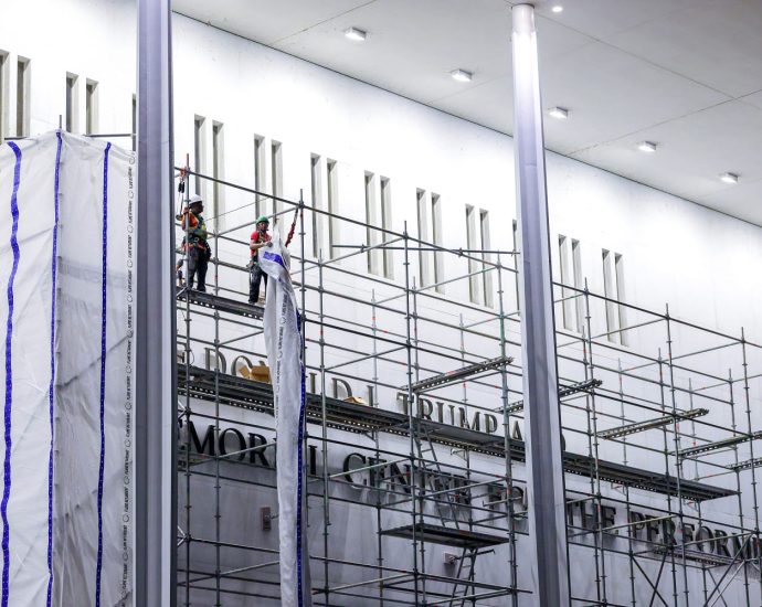 construction-workers-begin-removing-the-traitor’s-name-from-the-kennedy-center