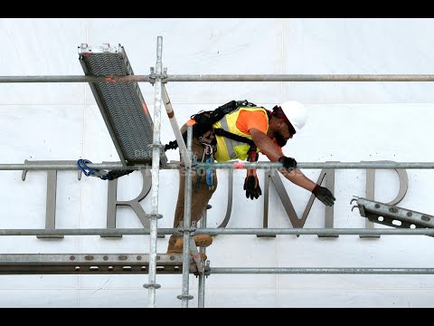 timelapse-of-workers-covering-signage-at-the-kennedy-center-before-removing-the-traitor’s-name
