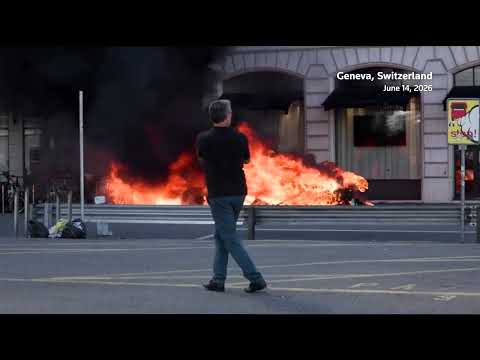 tesla-set-on-fire,-un-office’s-windows-smashed-in-anti-g7-march