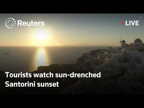 live:-tourists-watch-sun-drenched-santorini-sunset