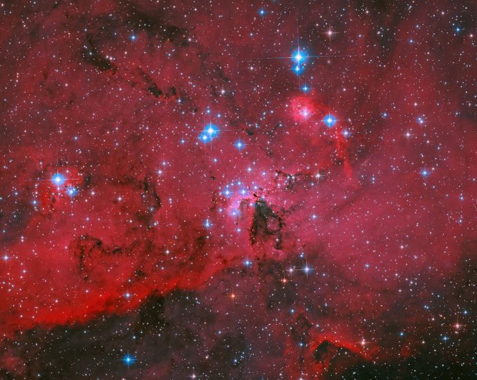 hubble-sees-crimson-cloud-and-stars