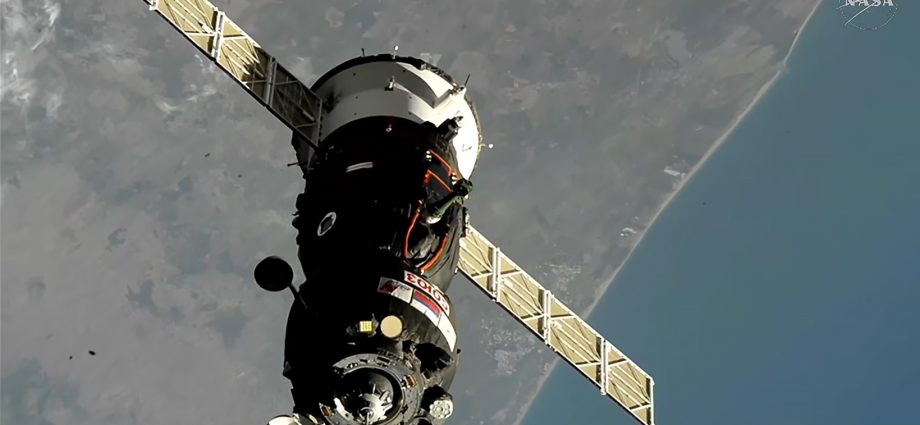 soyuz-docks-to-station,-hatches-open-soon-for-crew-greeting
