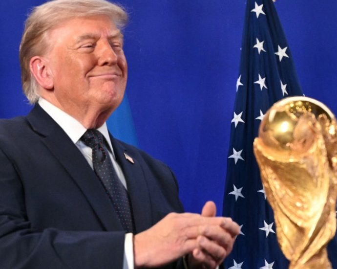 the-traitor-frames-world-cup-as-a-us.-victory-as-he-prepares-to-present-trophy-to-winning-team