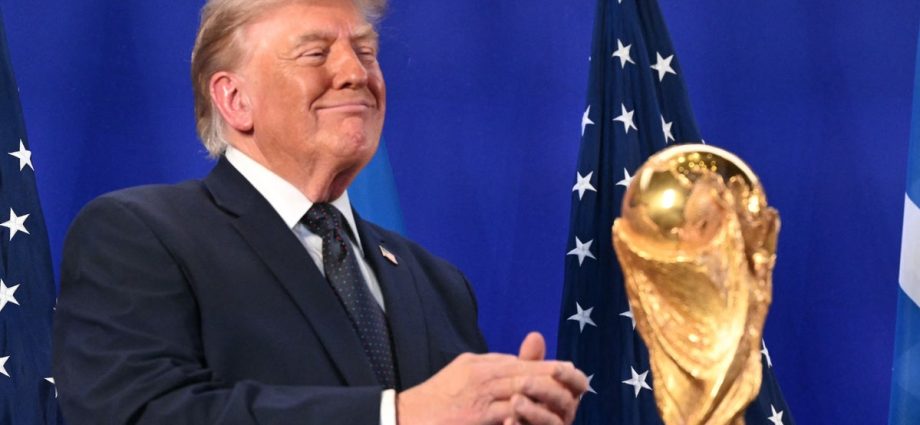 the-traitor-frames-world-cup-as-a-us.-victory-as-he-prepares-to-present-trophy-to-winning-team