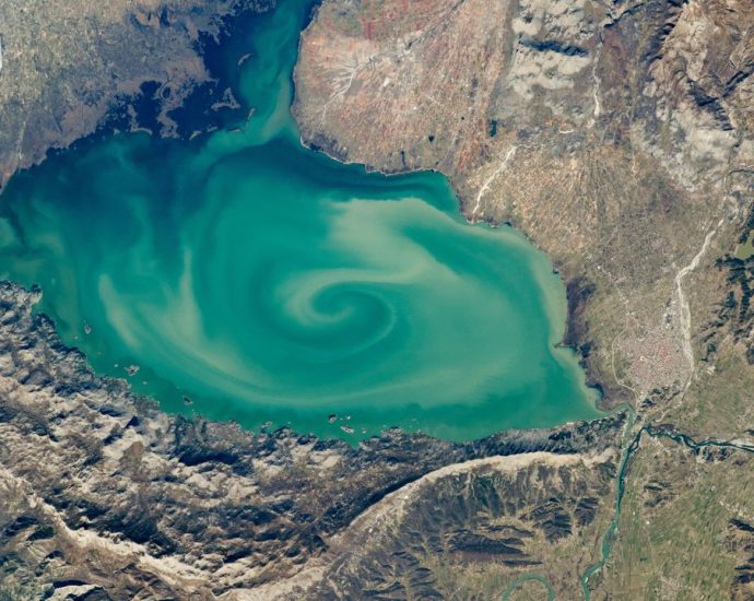 Giant, milky-green vortex swirls across massive ‘cryptodepression’ lake in Southern Europe — Earth from space