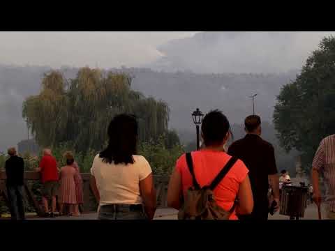 spanish-residents-look-on-as-a-wildfire-burns