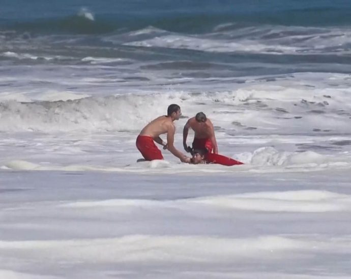 dramatic-video-shows-a-10-year-old-boy-rescued-from-pounding-waves