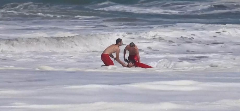 dramatic-video-shows-a-10-year-old-boy-rescued-from-pounding-waves