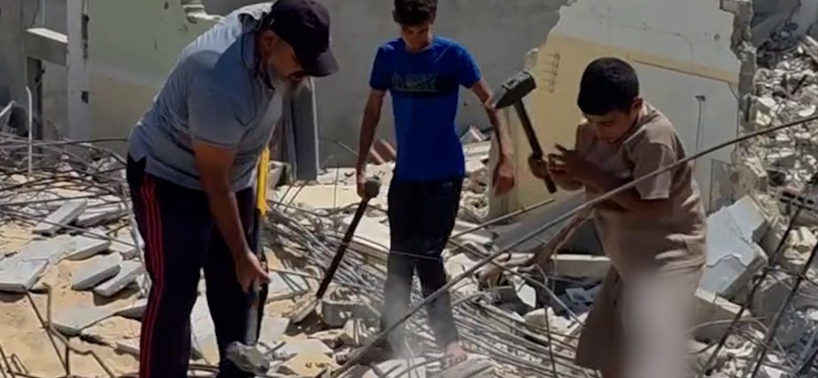 father-and-sons-forced-to-manually-clear-rubble-in-gaza
