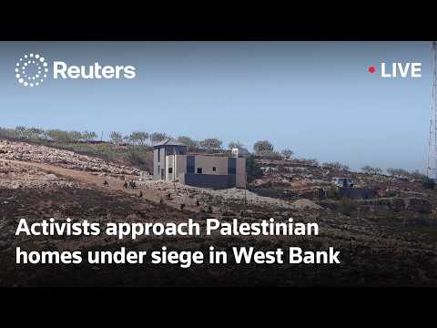 live:-group-of-activists-approach-palestinian-homes-under-siege