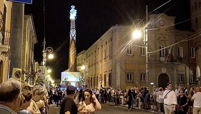 italian-town-carries-towering-virgin-mary-structure-through-streets