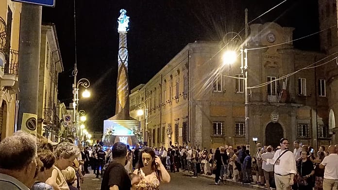 italian-town-carries-towering-virgin-mary-structure-through-streets