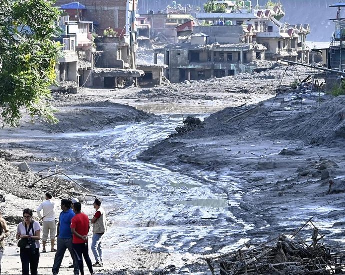 hundreds-feared-dead-as-new-flood-threat-stalls-rescue-efforts-in-nepal,-tibet