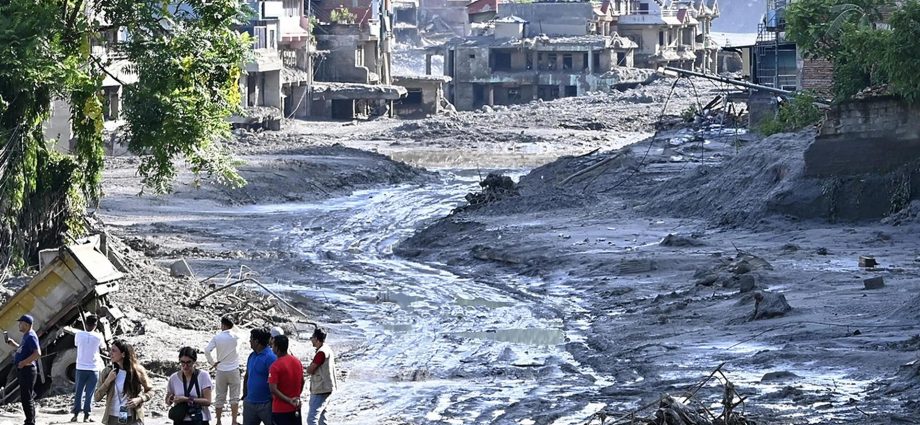 hundreds-feared-dead-as-new-flood-threat-stalls-rescue-efforts-in-nepal,-tibet