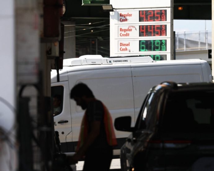 as-hostilities-flare-and-oil-prices-spike,-us.-consumers-pay-at-the-pump