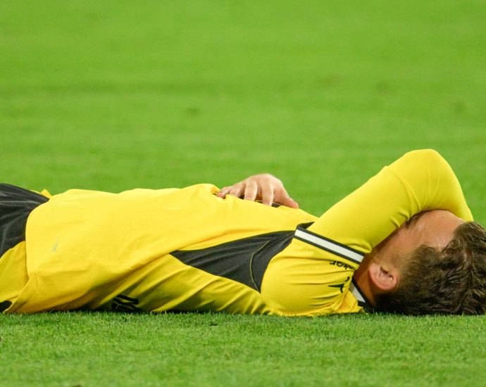 dortmund’s-karetsas-hospitalised-after-collapsing-in-champions-league-match