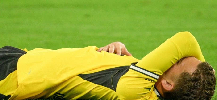 dortmund’s-karetsas-hospitalised-after-collapsing-in-champions-league-match