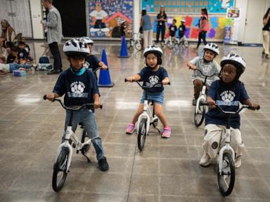 a-childhood-rite-moves-indoors-as-kindergartners-learn-to-ride-bikes-in-school-gyms