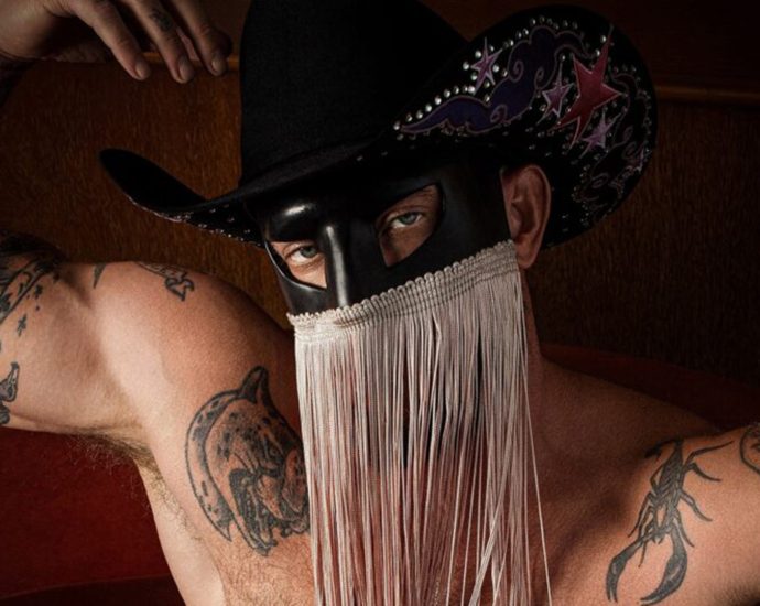 orville-peck-makes-history,-baring-all-but-his-face-for-‘playgirl’-cover