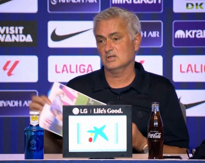 mourinho-holds-up-images-of-‘two-clear-red-cards’-after-atletico-defeat
