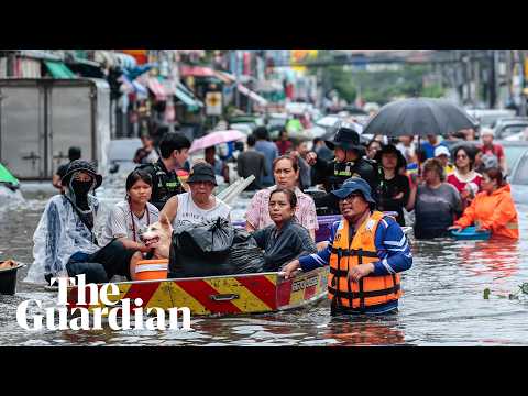 bangkok-residents-navigate-streets-by-boat-as-flood-waters-rise