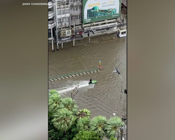 jet-ski-rider-cruises-through-flooded-streets-of-bangkok