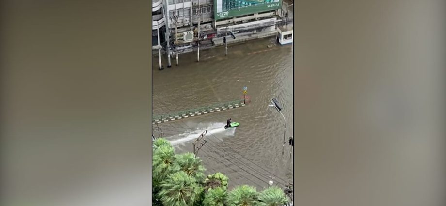 jet-ski-rider-cruises-through-flooded-streets-of-bangkok