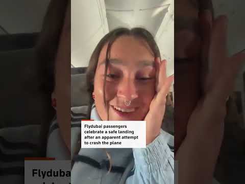 flydubai-passengers-celebrate-after-safe-landing-in-saudi-arabia