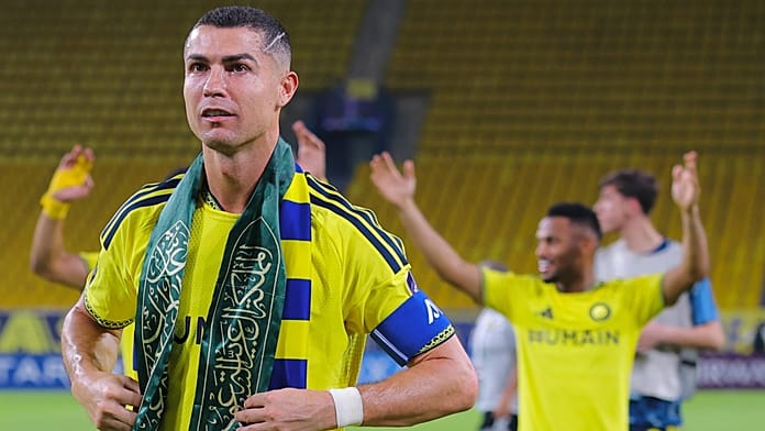 ronaldo-waves-saudi-flag-scarf-after-missile-alert-delays-asian-champions-league-match-in-riyadh