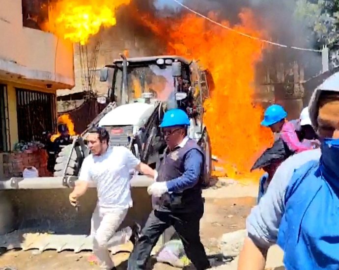 residents-douse-workers-with-flaming-gasoline-during-eviction-in-peru