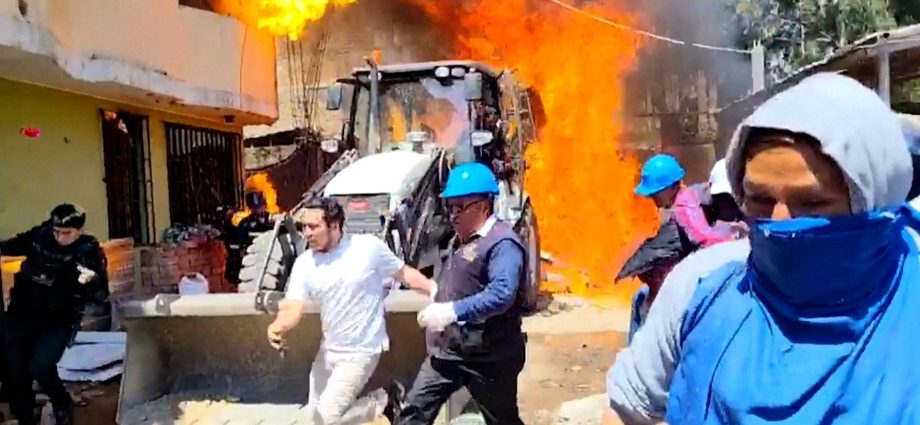 residents-douse-workers-with-flaming-gasoline-during-eviction-in-peru