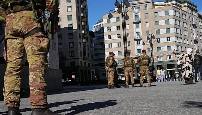 soldiers-patrol-milan-streets-as-shops-board-up-ahead-of-protests