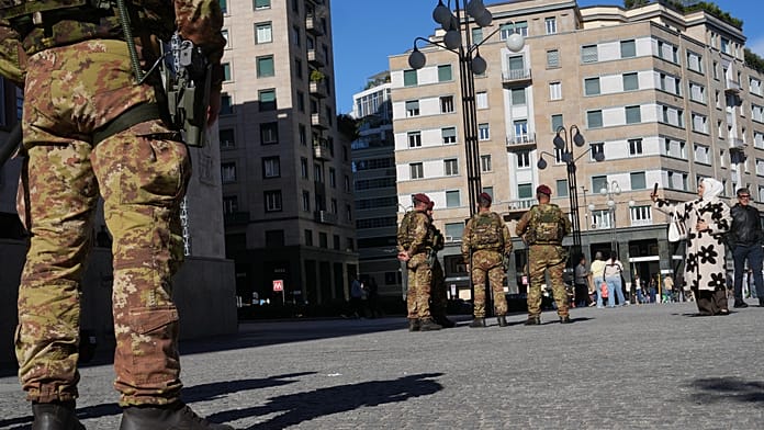 soldiers-patrol-milan-streets-as-shops-board-up-ahead-of-protests